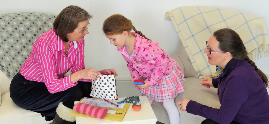educational psychologist with child and mum
