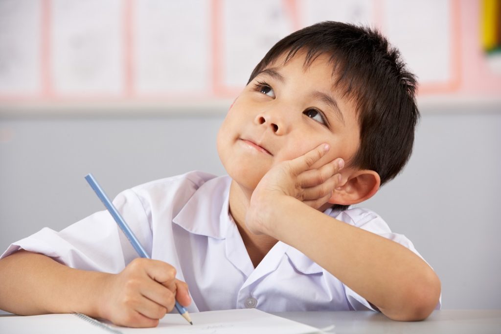 Boy thinking in class